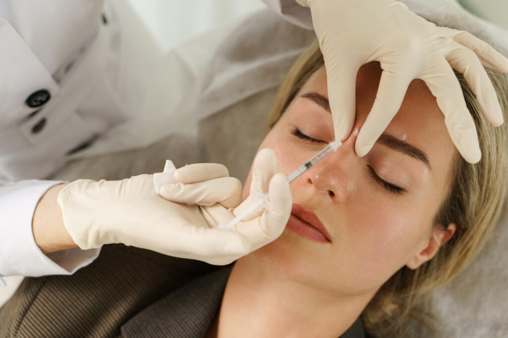 Dermal fillers for forehead wrinkles on woman skin
