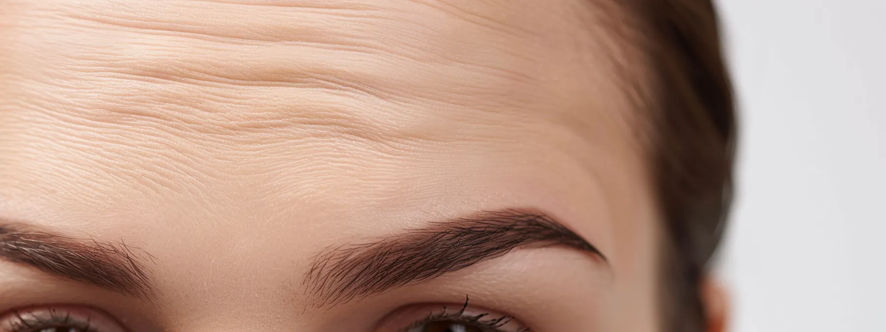 a close-up photo capturing a smooth, wrinkle-free forehead after a botox treatment at a medical spa.