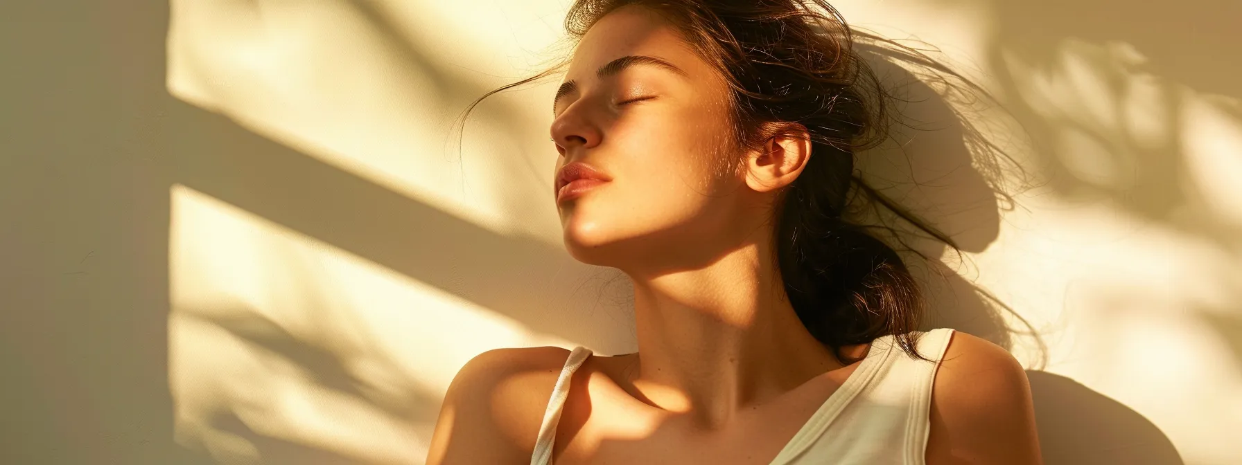 a woman basking in the glow of smooth, hair-free skin after painless laser hair removal treatment.